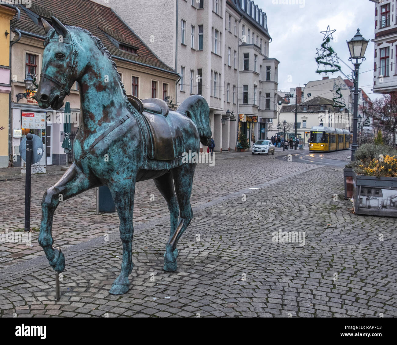 AltKöpenick,Berlin Bronze sculpture of horse, cobbled road and old