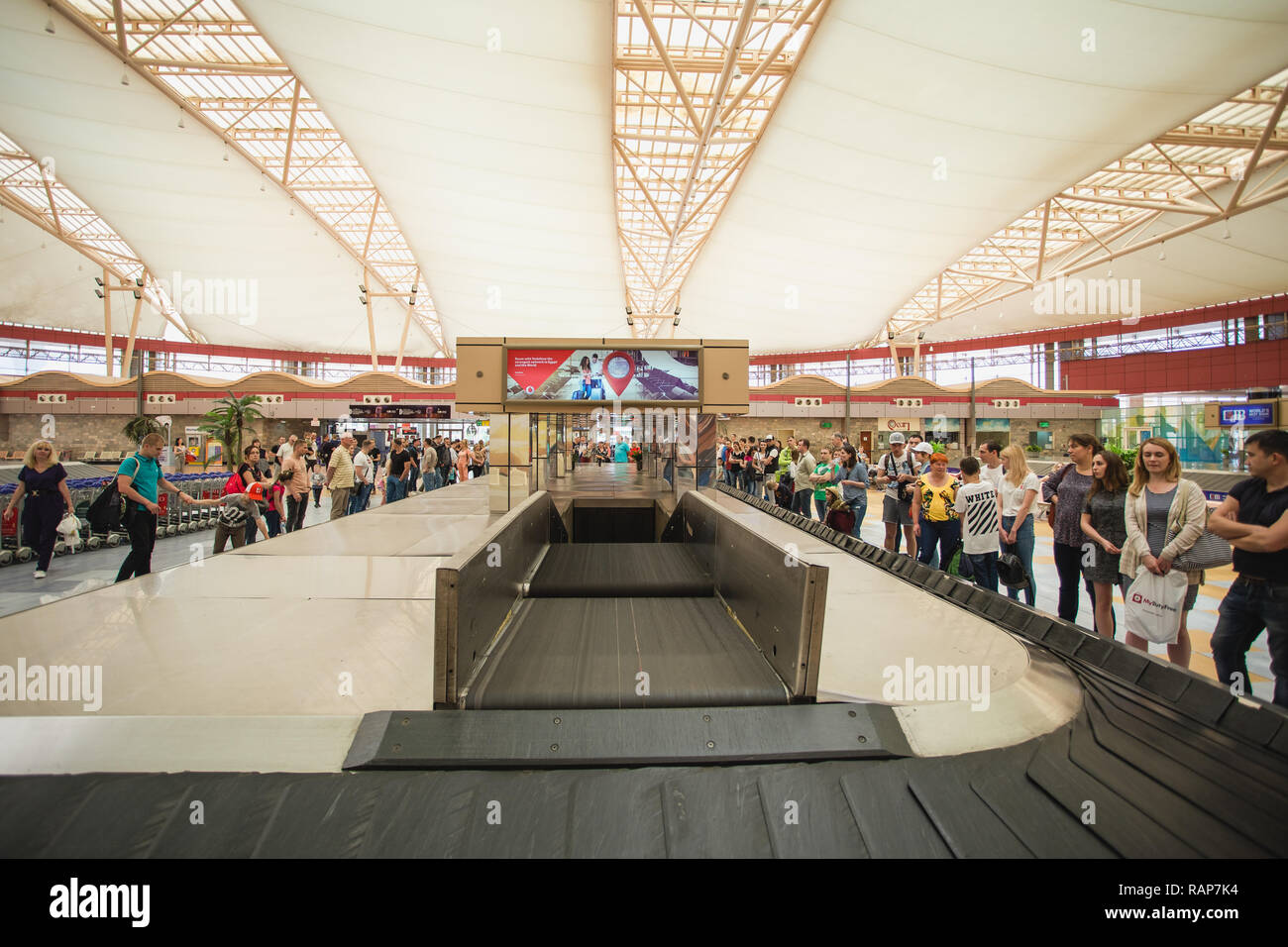 SHARM EL SHEIKH, EGYPT - 14 MAY 2018: Interior of international terminal in Sharm El Sheikh, Egypt. Tourists waiting their bags and suitcases at airpo Stock Photo