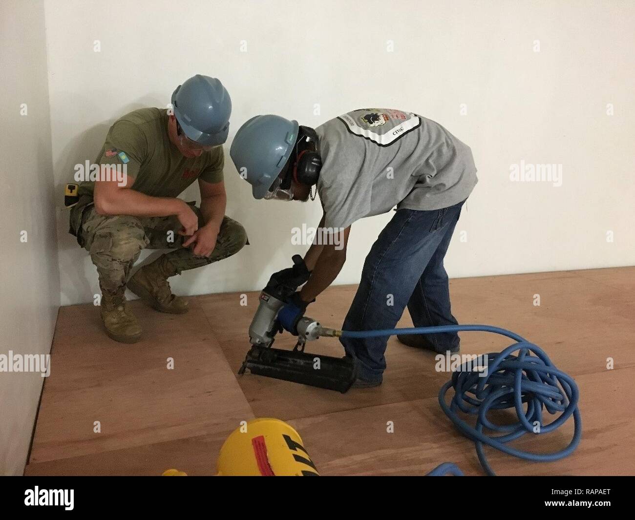 Dillion A Builder Apprentice Learns To Use The Pneumatic Nailer While