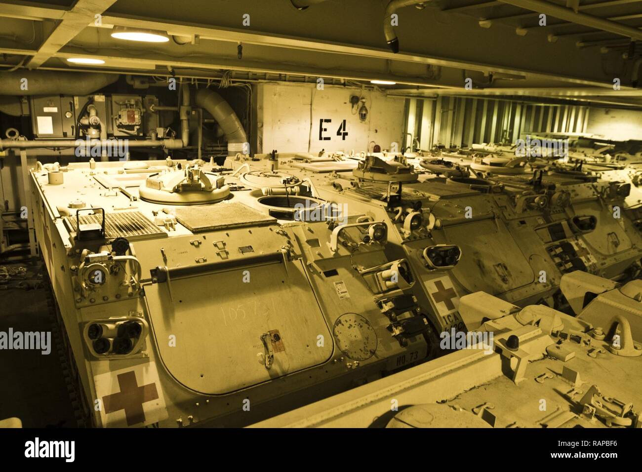 M113 Armored Personnel Carriers are staged on the USNS Mendonca at Shuaiba Port, Kuwait, on Feb. 28, 2017. The Mendonca is used to import and export U.S. Military vehicles in support of operations in the USCENTCOM AOR. Stock Photo