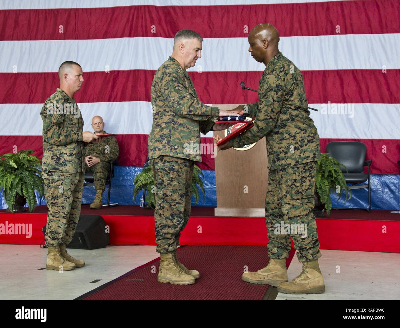 U.S. Marine Corps Gen. Glenn M. Walters, middle, 34th assistant commandant of the Marine Corps