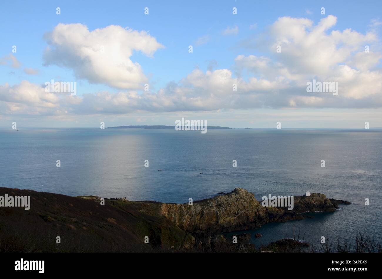 View of the island of Jersey in the distance viewed from Jerbourg Point,  Guernsey, UK Stock Photo - Alamy