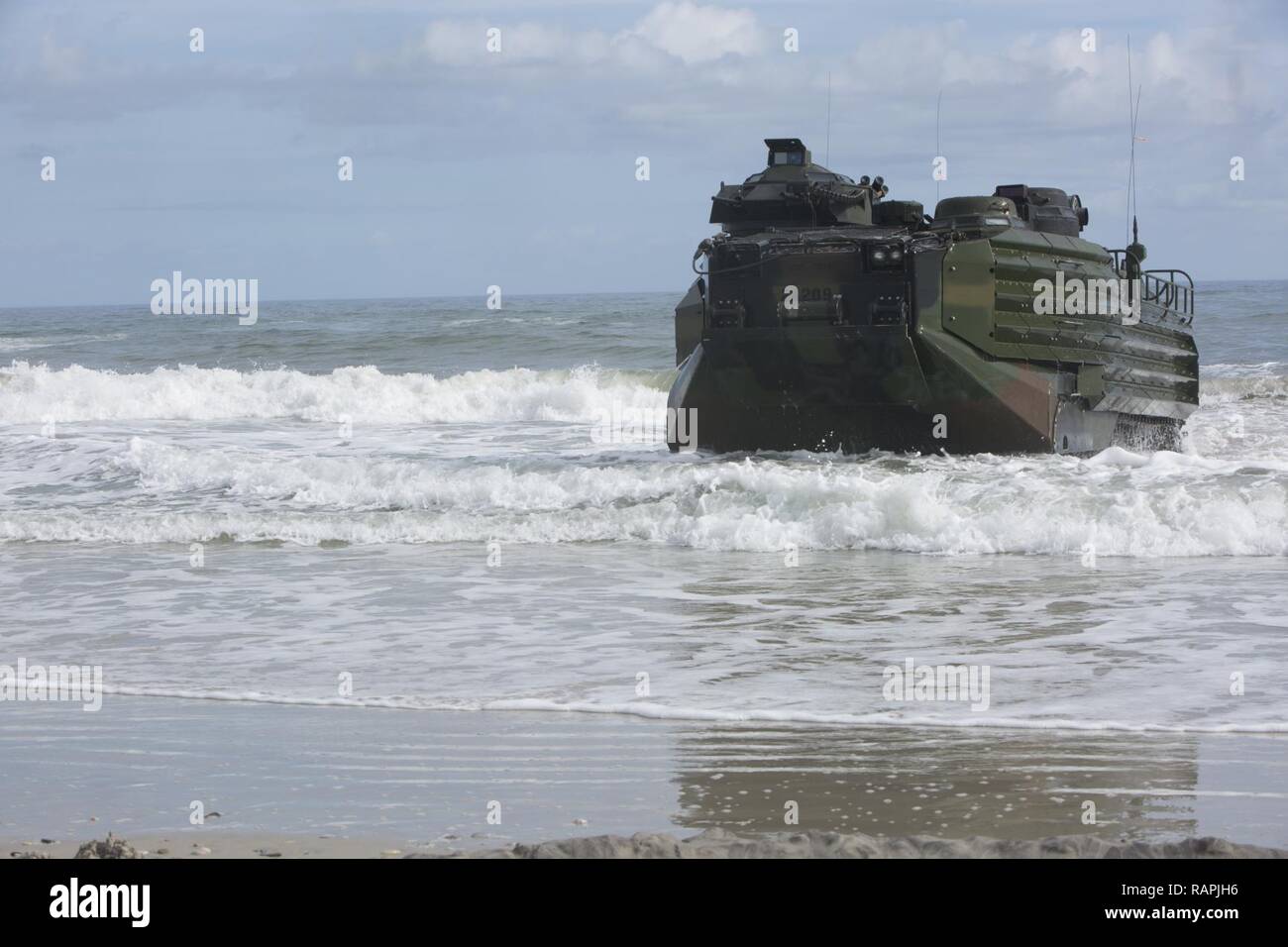 U.S. Marines with 2nd Platoon, Alpha Company, 2nd Assault Amphibian Battalion, 2nd Marine Division (2d MARDIV), manuever an AAV-P7/A1 assault amphibious vehicle through the water at Onslow Beach, Camp Lejeune, N.C., Feb. 22, 2017. Marines conducted amphibious assaults to enhance and maintain proficiency on ship to shore movement. Stock Photo