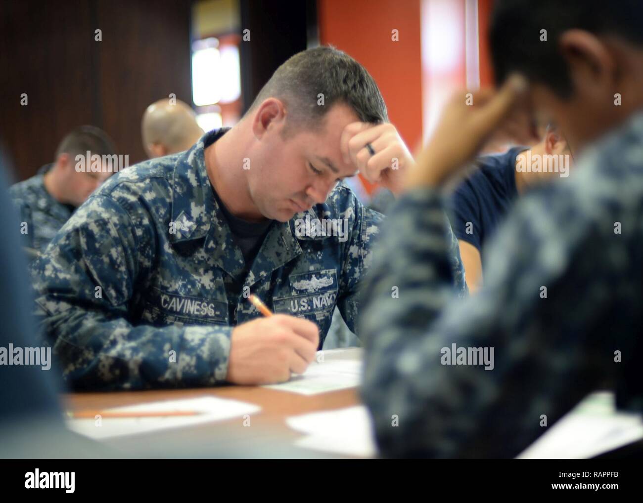 ANTA RITA, Guam (March 2, 2017) – Electronics Technician 2nd Class Christopher Caviness, assigned to the submarine tender USS Frank Cable (AS 40) and native of Climax, N.C., takes the Navy-wide E-6 advancement exam at Naval Base Guam, March 2.  Frank Cable is forward-deployed to the island of Guam and conducts maintenance and support of submarines and surface vessels deployed to the U.S. 5th and 7th Fleet area of operations. Stock Photo
