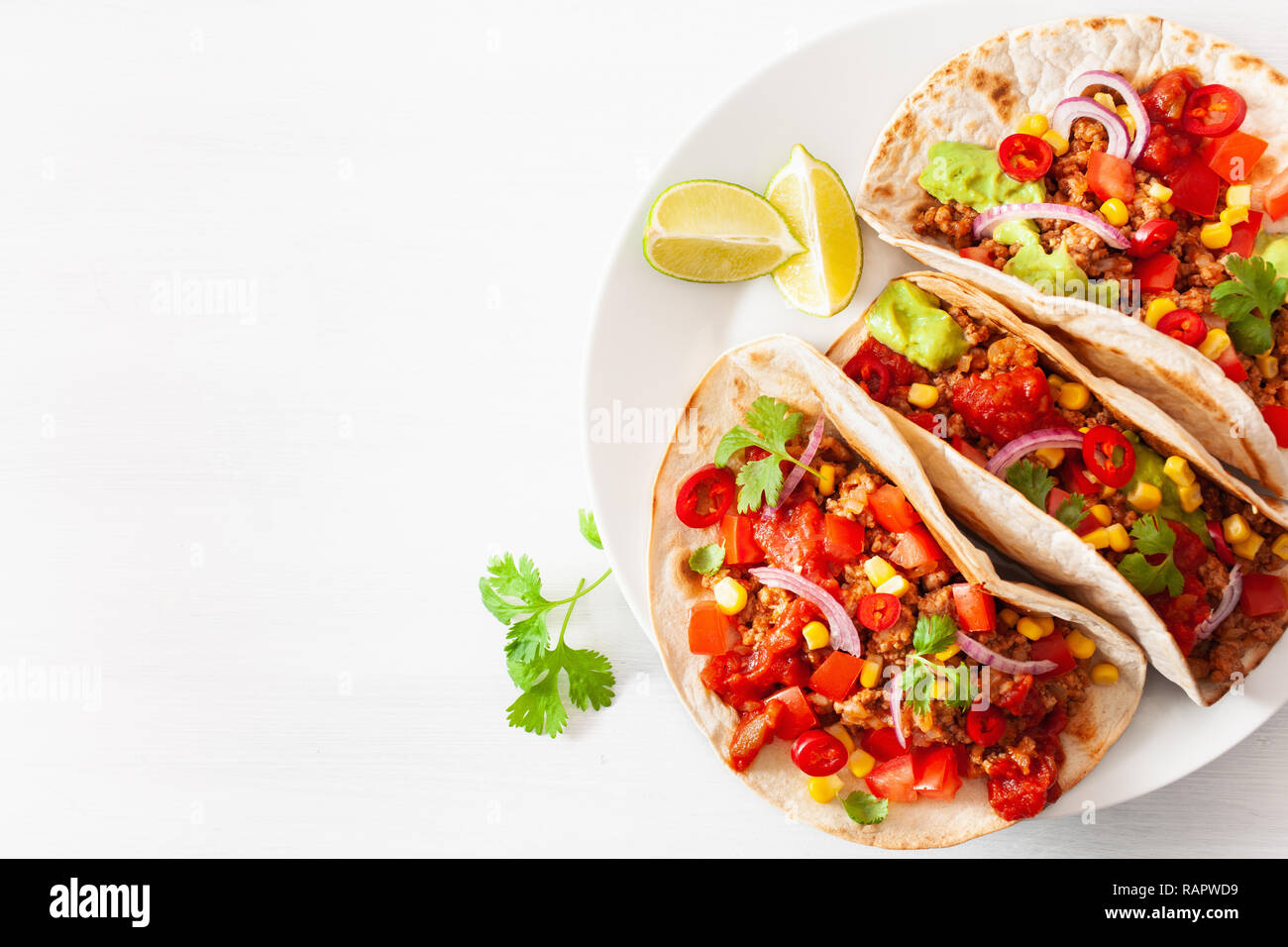 mexican beef and pork tacos with salsa, guacamole and vegetables Stock Photo Alamy