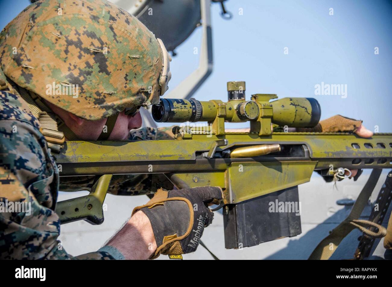 EAST CHINA SEA (March 4, 2017) Marine Cpl. Kevin McDonald, from Sellersville, Penn., assigned to Battalion Landing Team 2nd Battalion, 5th Marines, fires a .50-caliber rifle during a defense of the amphibious task force (DATF) gunnery exercise aboard the amphibious transport dock ship USS Green Bay (LPD 20). During the DATF exercise, Green Bay’s small caliber action team (SCAT) worked together with Marines from the 31st Marine Expeditionary Unit (MEU) in order to provide 360-degree coverage of the ship. Green Bay, with embarked 31st MEU, is on a routine patrol, operating in the Indo-Asia-Pacif Stock Photo