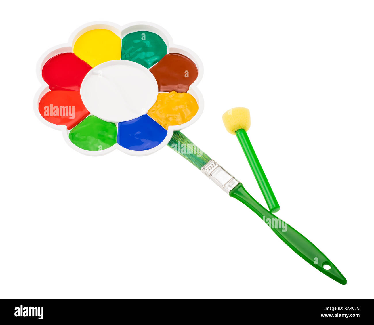 Flower shaped art palette with paintbrushes Stock Photo