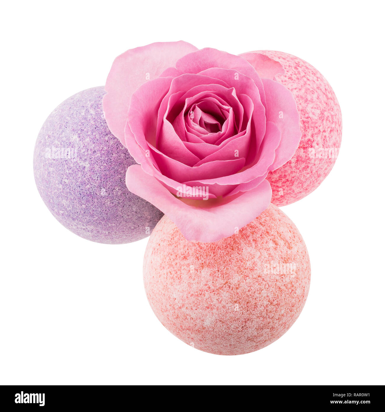 Three spotted bath bombs with pink rose Stock Photo