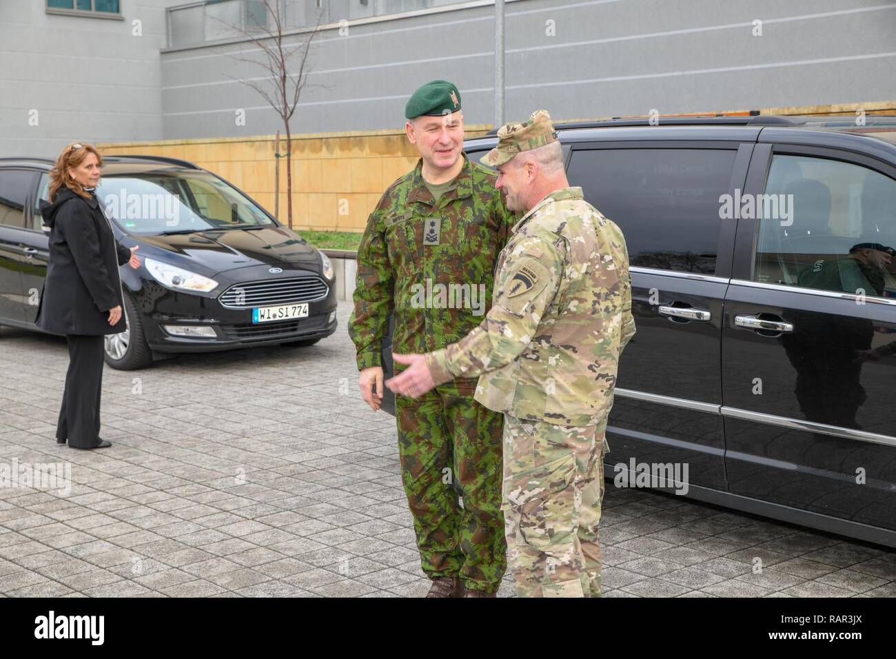 Lt. Gen. Christopher Cavoli, U.S. Army Europe commander, welcomes Maj. Gen.  Valdemaras Rupšys, Lithuanian Land Force commander, to U.S. Army Europe  headquarters with an honor cordon. Rupšys and Sgt. Maj. Remigijus Katinas,