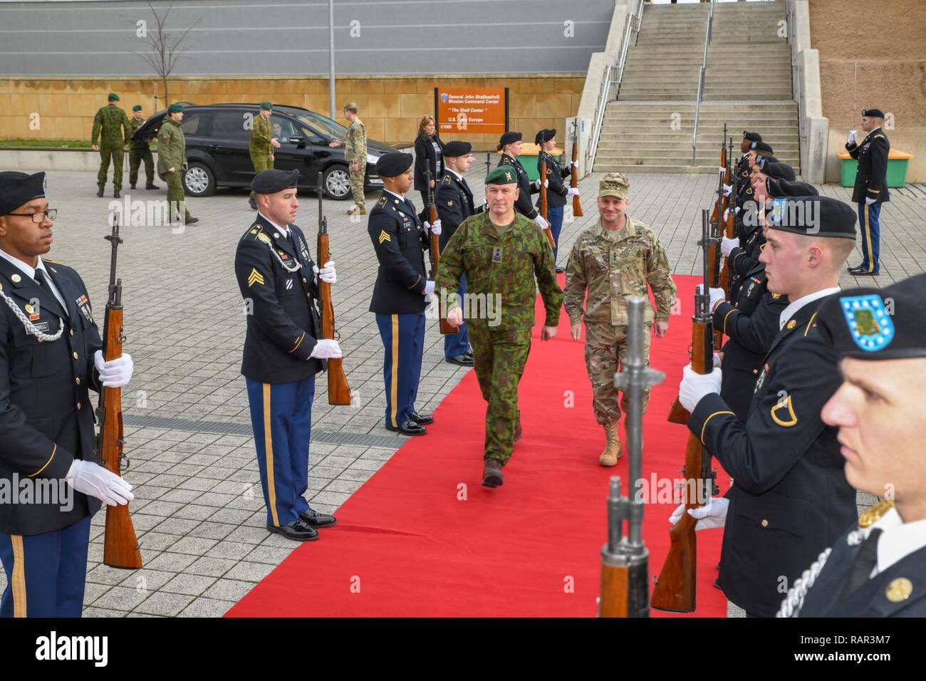 Lt. Gen. Christopher Cavoli, U.S. Army Europe commander, welcomes Maj. Gen.  Valdemaras Rupšys, Lithuanian Land Force commander, to U.S. Army Europe  headquarters with an honor cordon. Rupšys and Sgt. Maj. Remigijus Katinas,