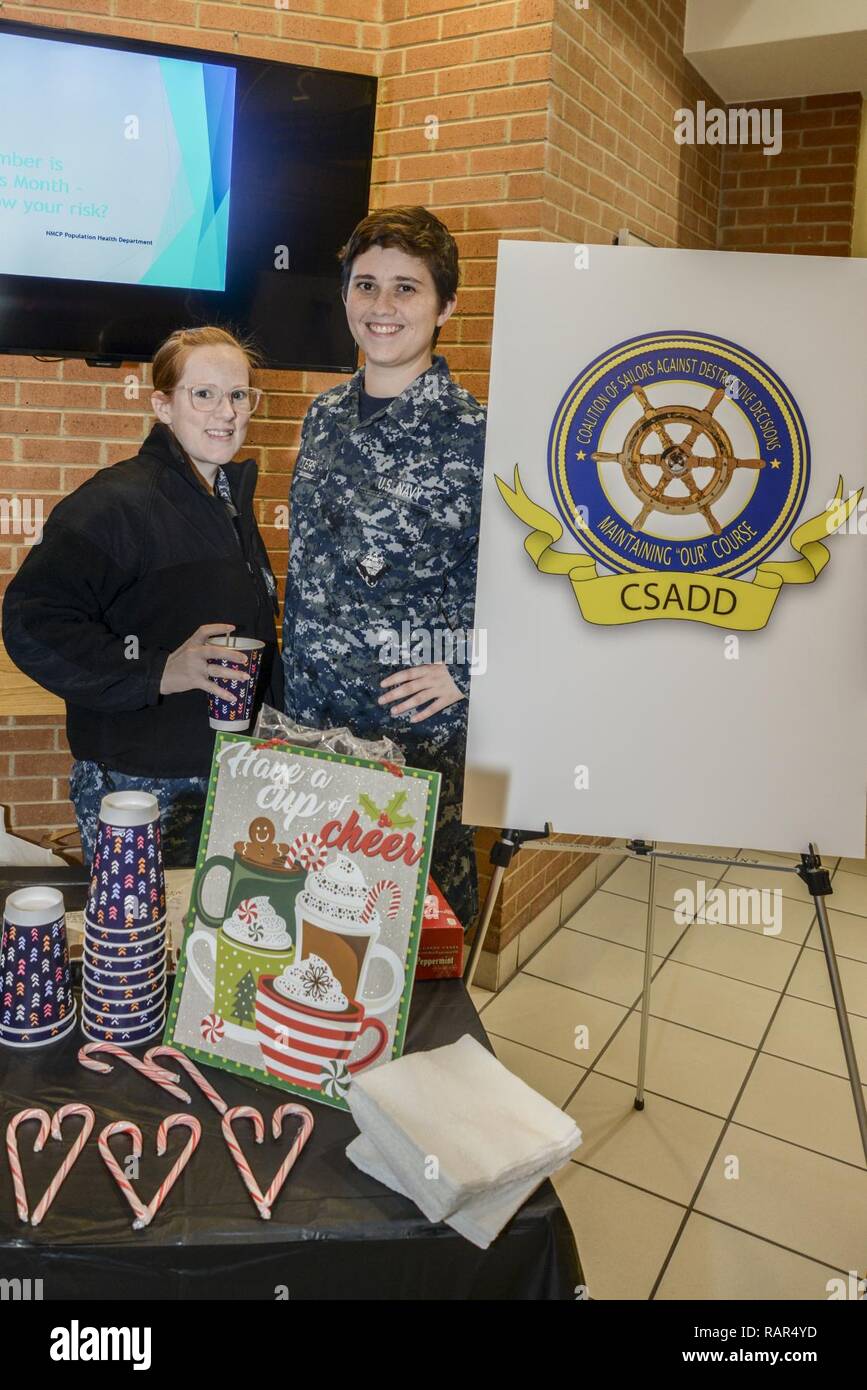 – CSADD staff members provide hot chocolate and candy canes for the medical center during the holiday Informational Fair. Stock Photo