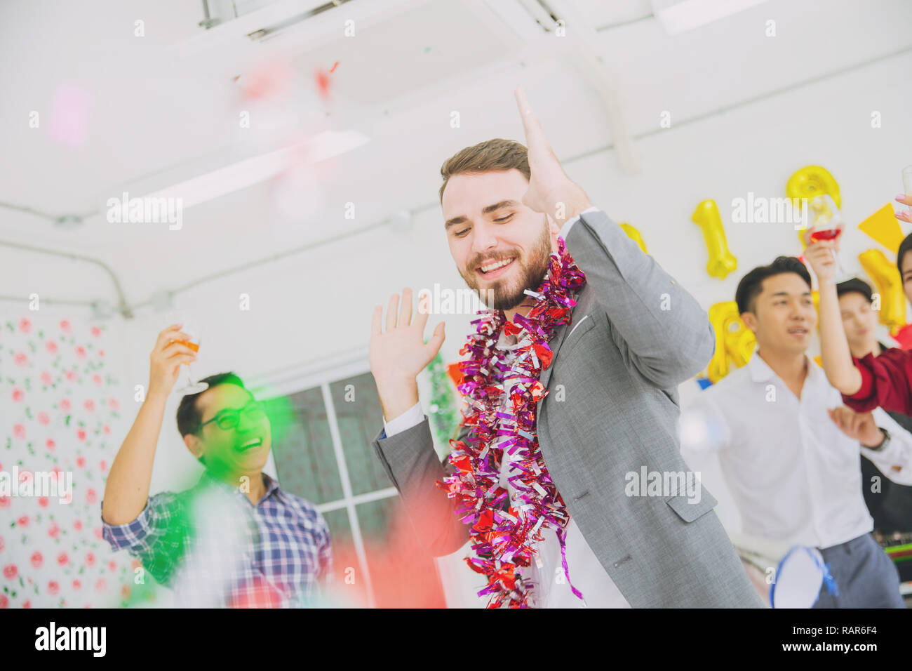 caucasian boss businessman dance in office party new year fun celebration. Stock Photo