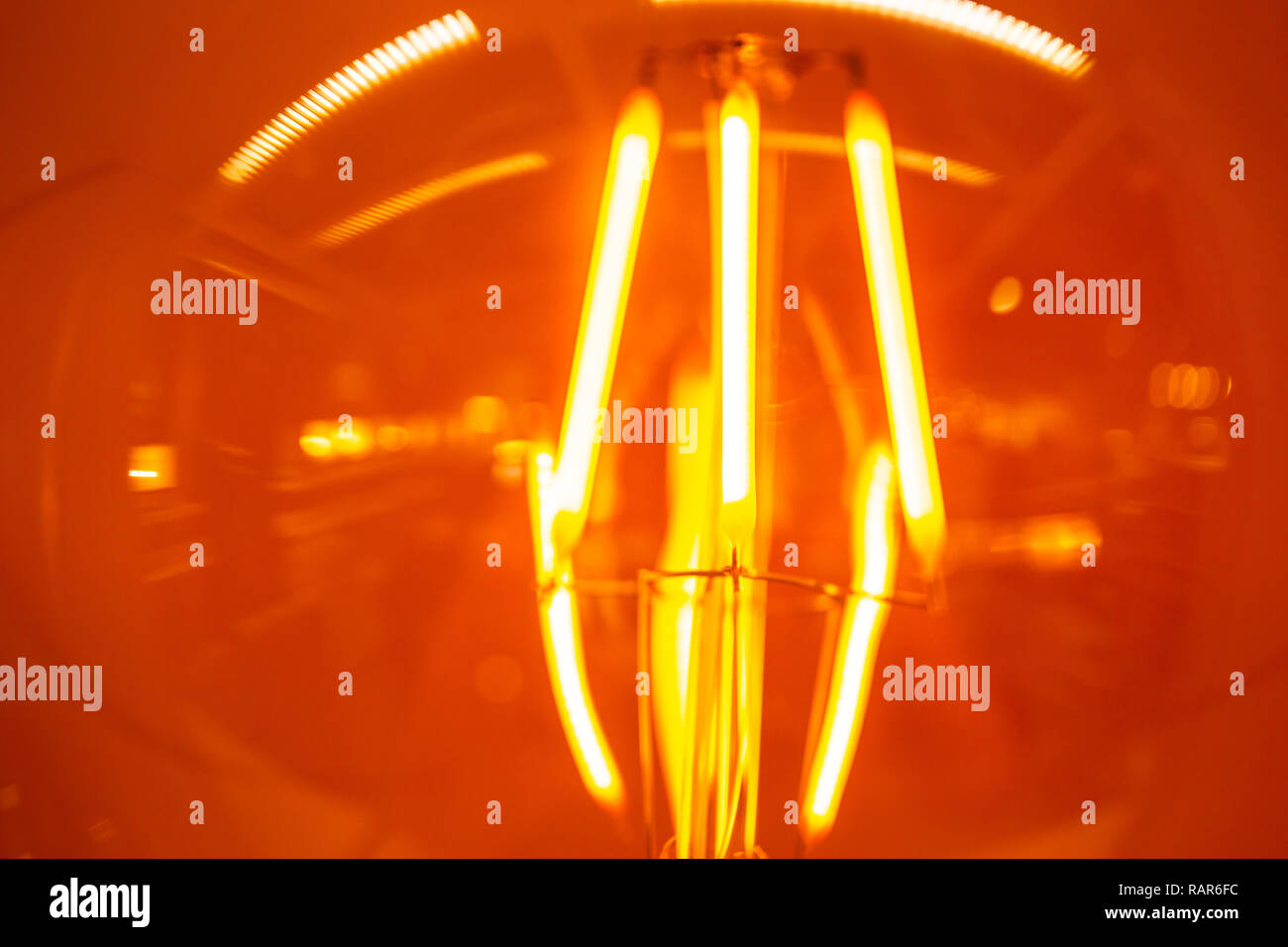 closeup vintage light bulb glow hot burn filament incandescent lamp