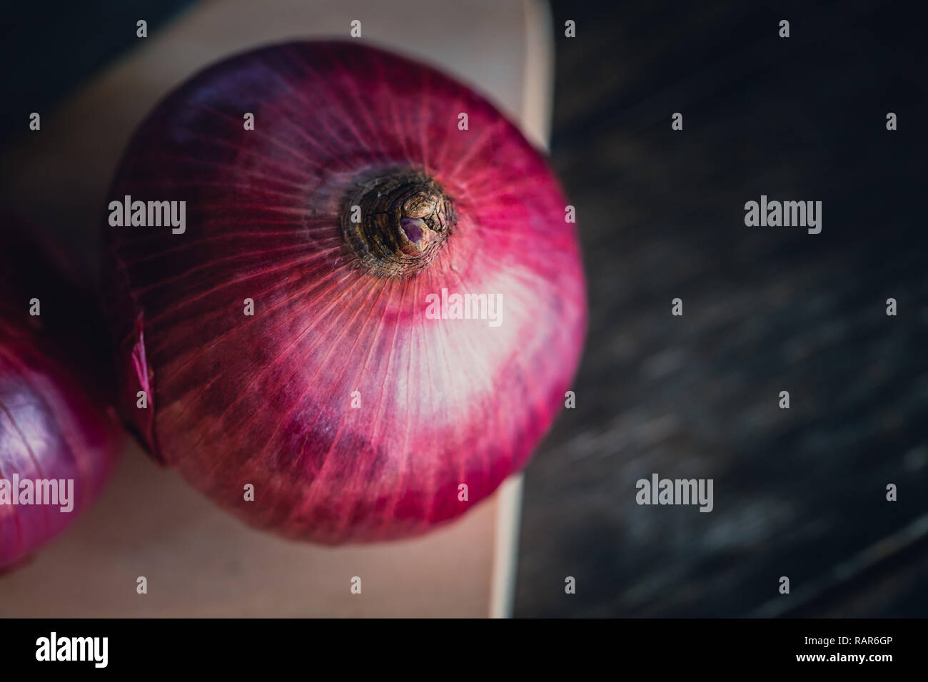 Shallot red onion on rustic wooden table background. Stock Photo