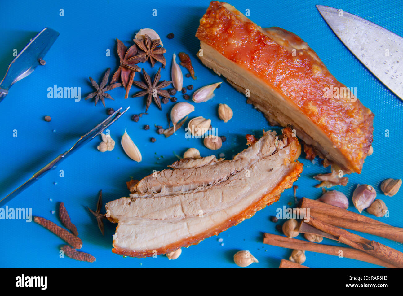 Roasted Pork belly bacon or Streaky Pork with aroma herbal food decoration. Stock Photo