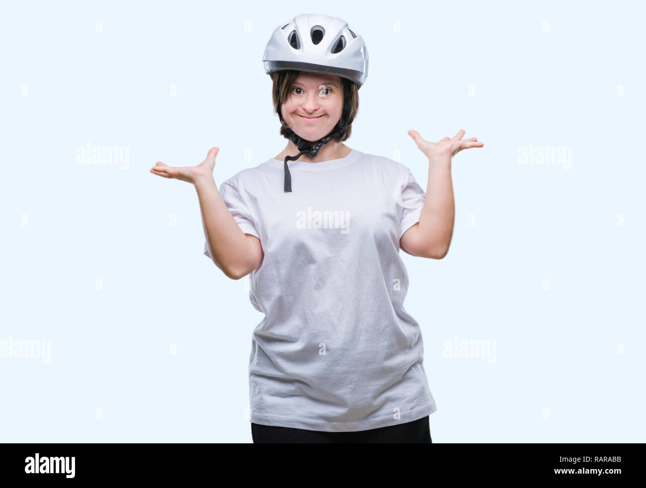 Young adult cyclist woman with down syndrome wearing safety helmet over