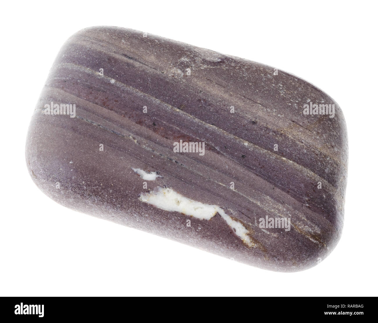 macro photography of natural mineral from geological collection - tumbled argillite (mudstone) stone on white background Stock Photo