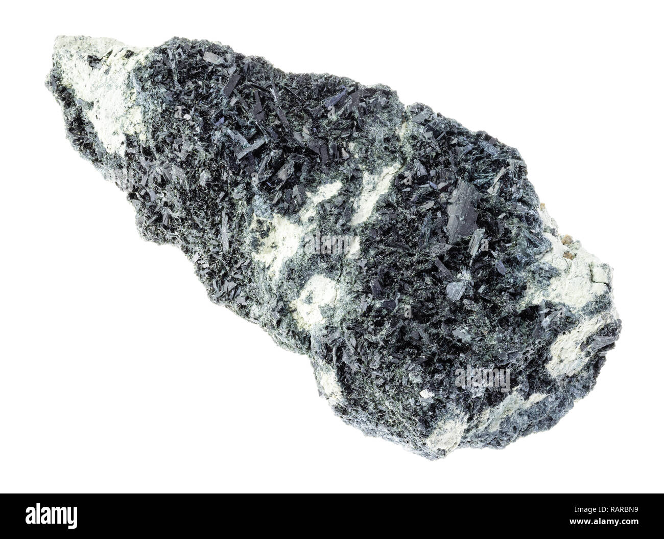 macro photography of natural mineral from geological collection - hornblende crystals on raw amphibole - carbonate rock on white background Stock Photo