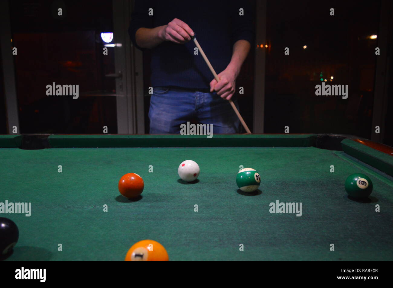 Game of pool, person playing pool and hitting balls Stock Photo Alamy