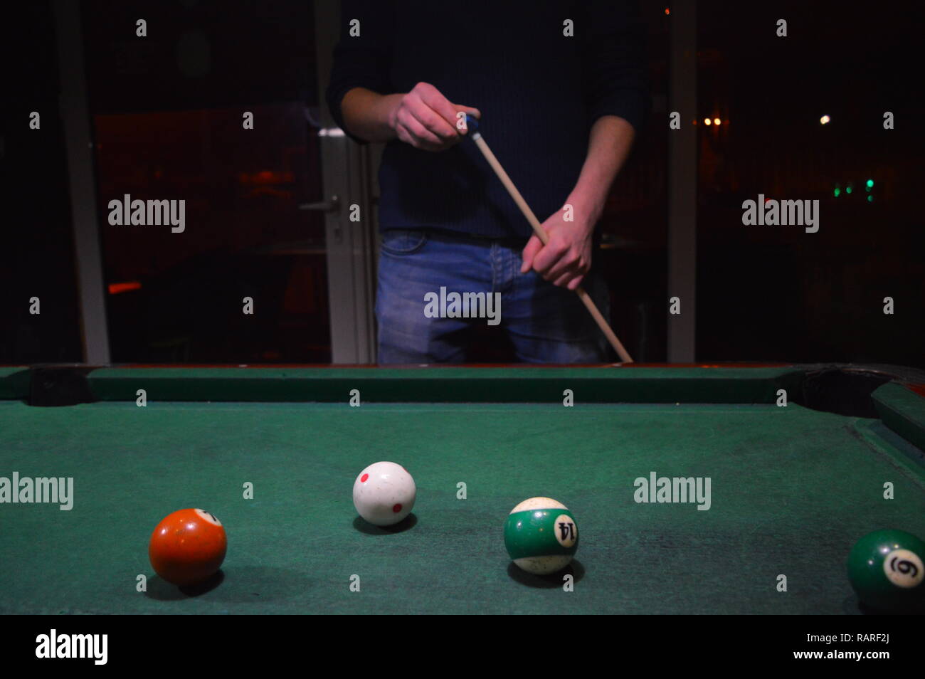 Game of pool, person playing pool and hitting balls Stock Photo Alamy