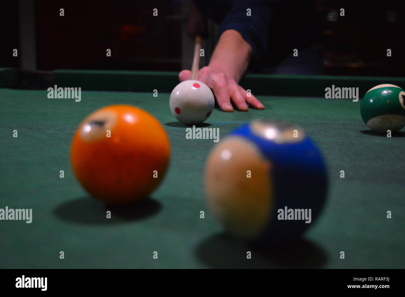 Game of pool, person playing pool and hitting balls Stock Photo Alamy
