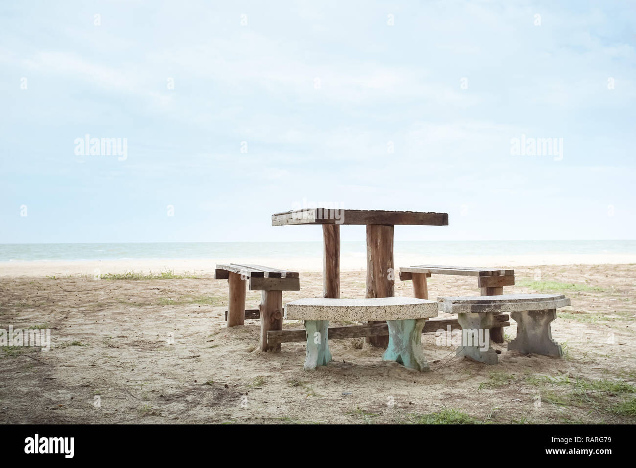 Table set with bench on the beach, Laem Talumphuk, Pak Phanang, Nakhon Si Thammarat, Thailand. Stock Photo