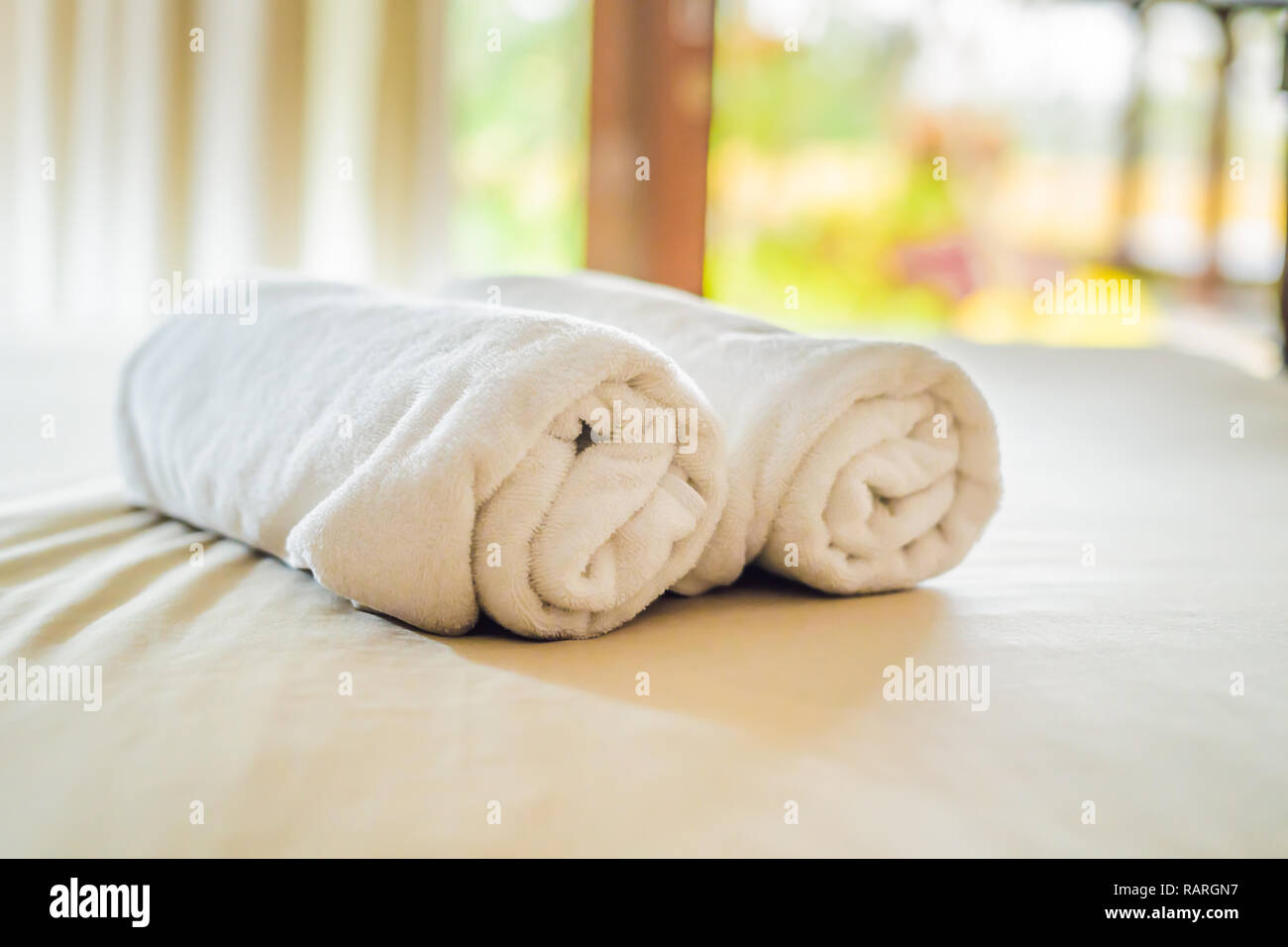 beautiful room in villa, towel on the bed Stock Photo - Alamy