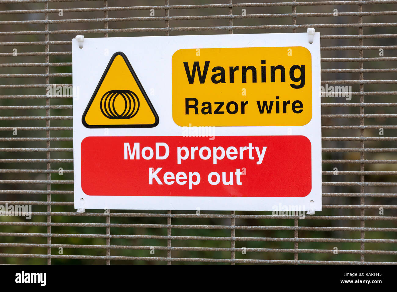 Instow, North Devon, England, UK. January 2019. Ministry of Defence warning sign of razor wire. Stock Photo