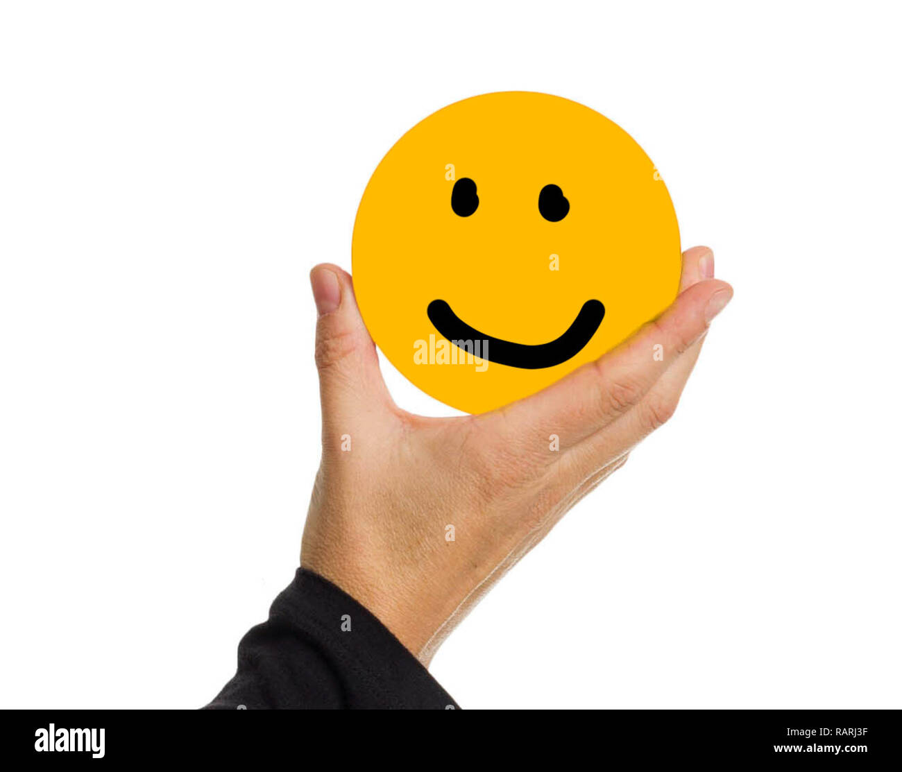 https://c8.alamy.com/comp/RARJ3F/hand-holding-a-yellow-circle-with-face-expression-smiling-RARJ3F.jpg