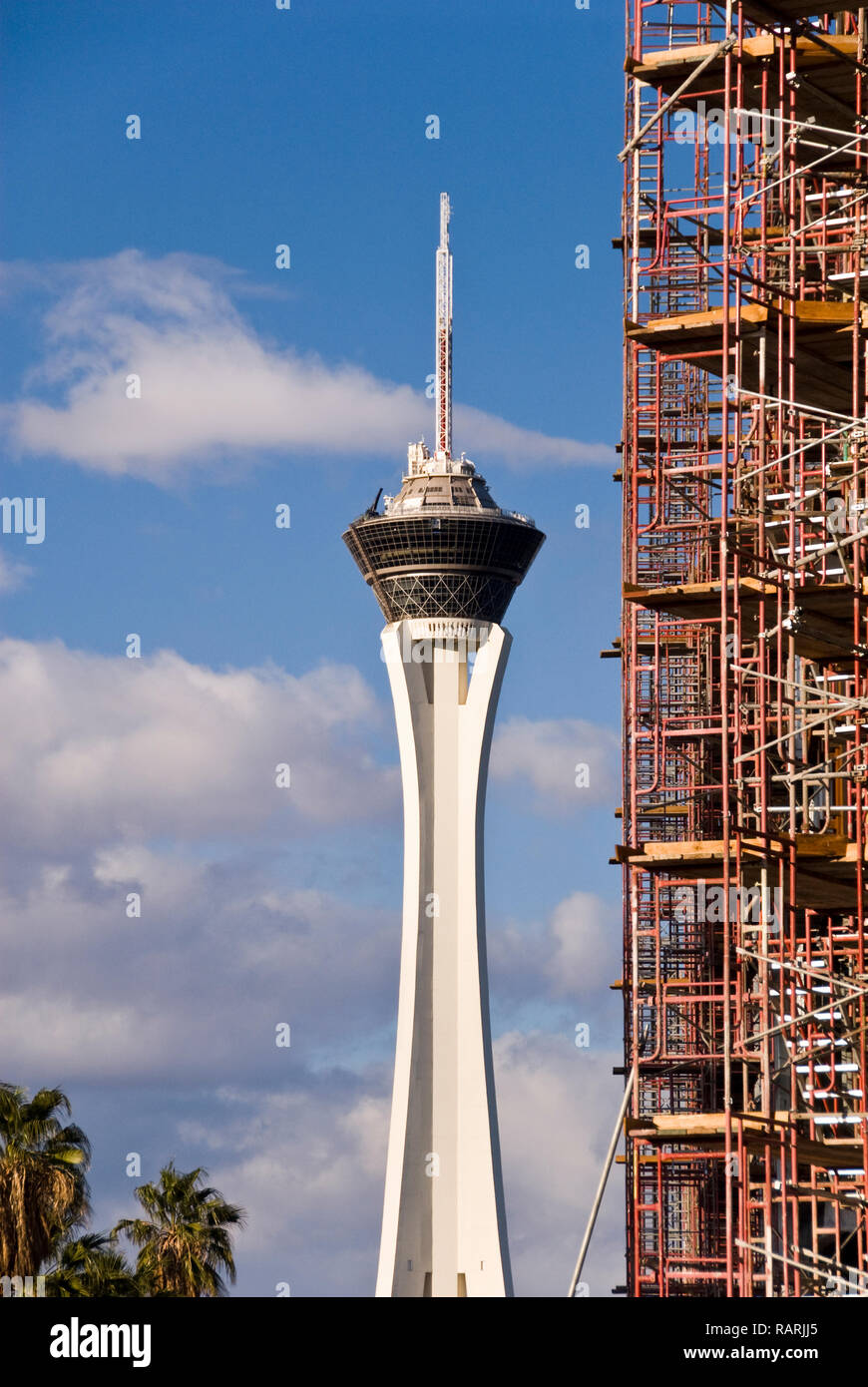 View at the top of the Stratosphere Hotel in Las Vegas, Nevada. The very  top of the tower, the 'Big Shot' ride, is pictured against a blue cloudy  sky. Copy space on