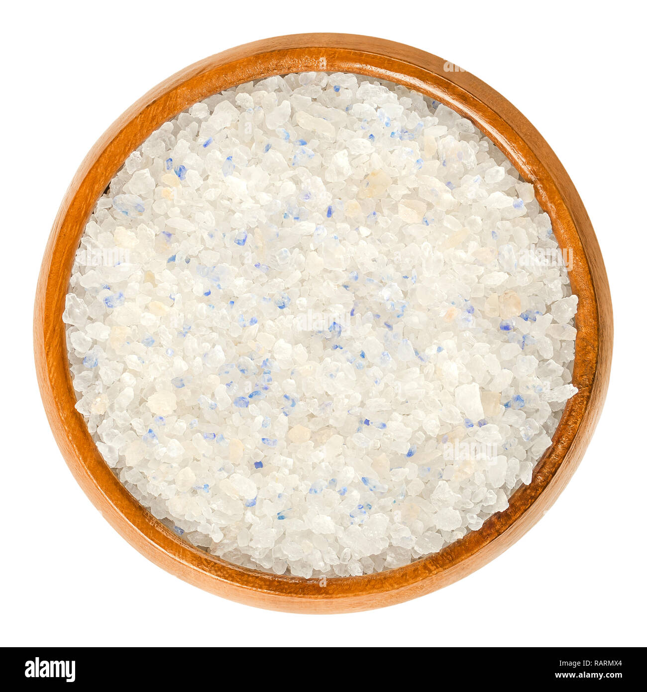 Persian Blue Salt in wooden bowl. Fine rock salt from Iran. Blue color occurs during forming the crystalline structure, caused by an optical illusion. Stock Photo