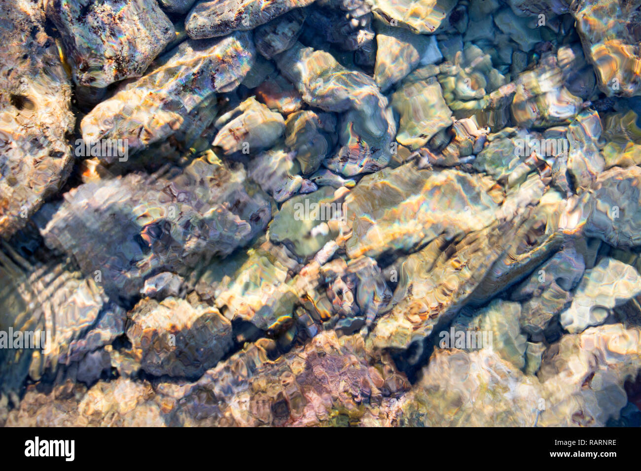 Pebbles of differen sizes in salt water Stock Photo
