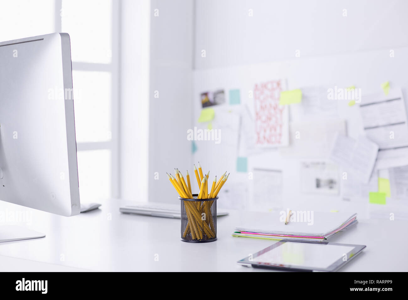 Graphite pencils in a metal grid-container. Concept. Stock Photo