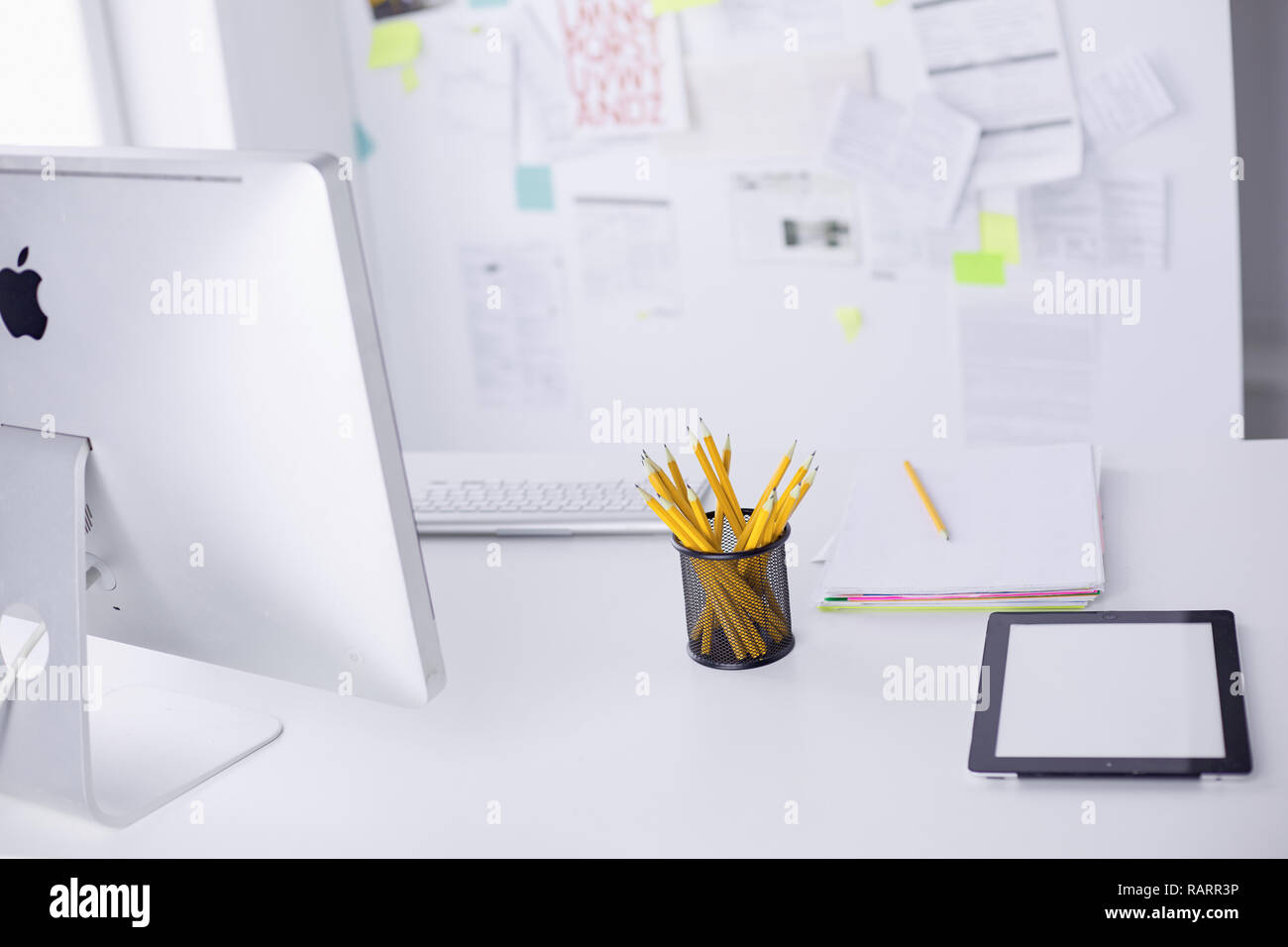 Graphite pencils in a metal grid-container. Concept. Stock Photo