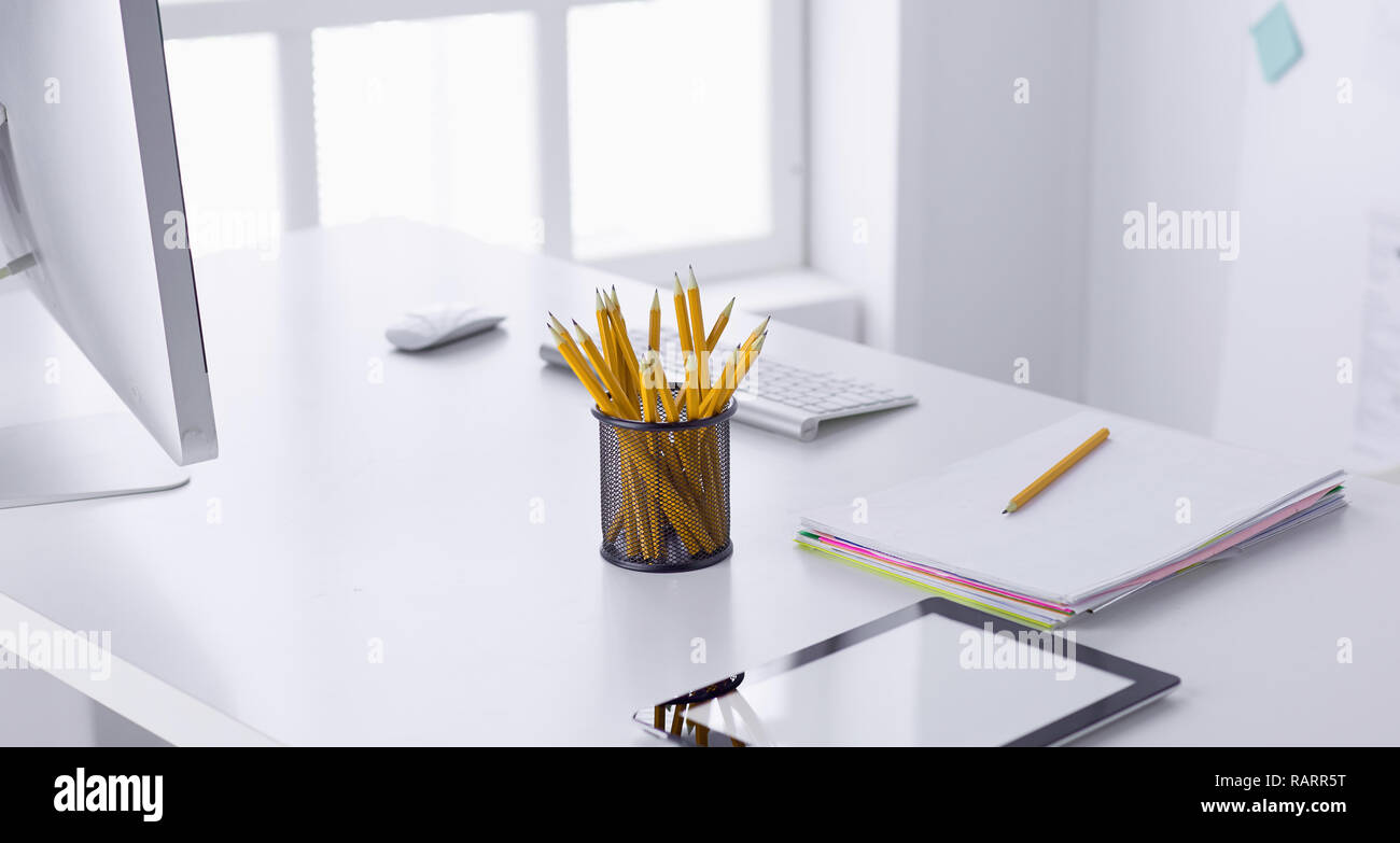 Graphite pencils in a metal grid-container. Concept. Stock Photo