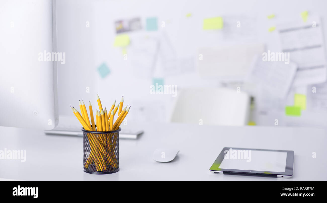 Graphite pencils in a metal grid-container. Concept. Stock Photo