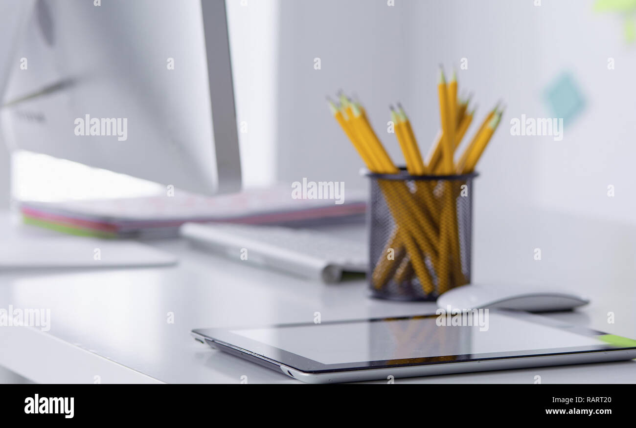 Graphite pencils in a metal grid-container. Concept. Stock Photo