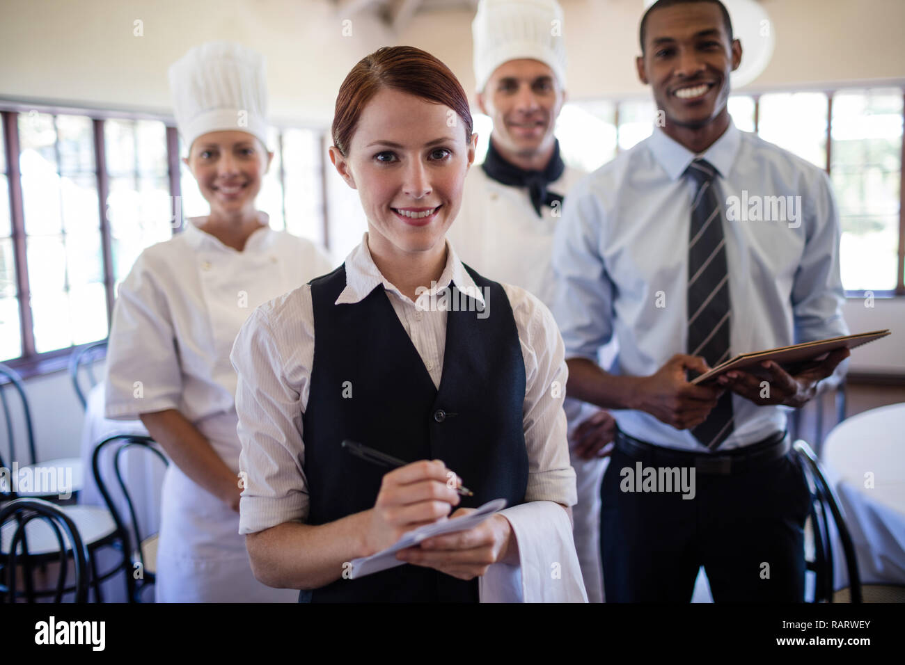 Group of hotel staffs standing in hotel Stock Photo Alamy