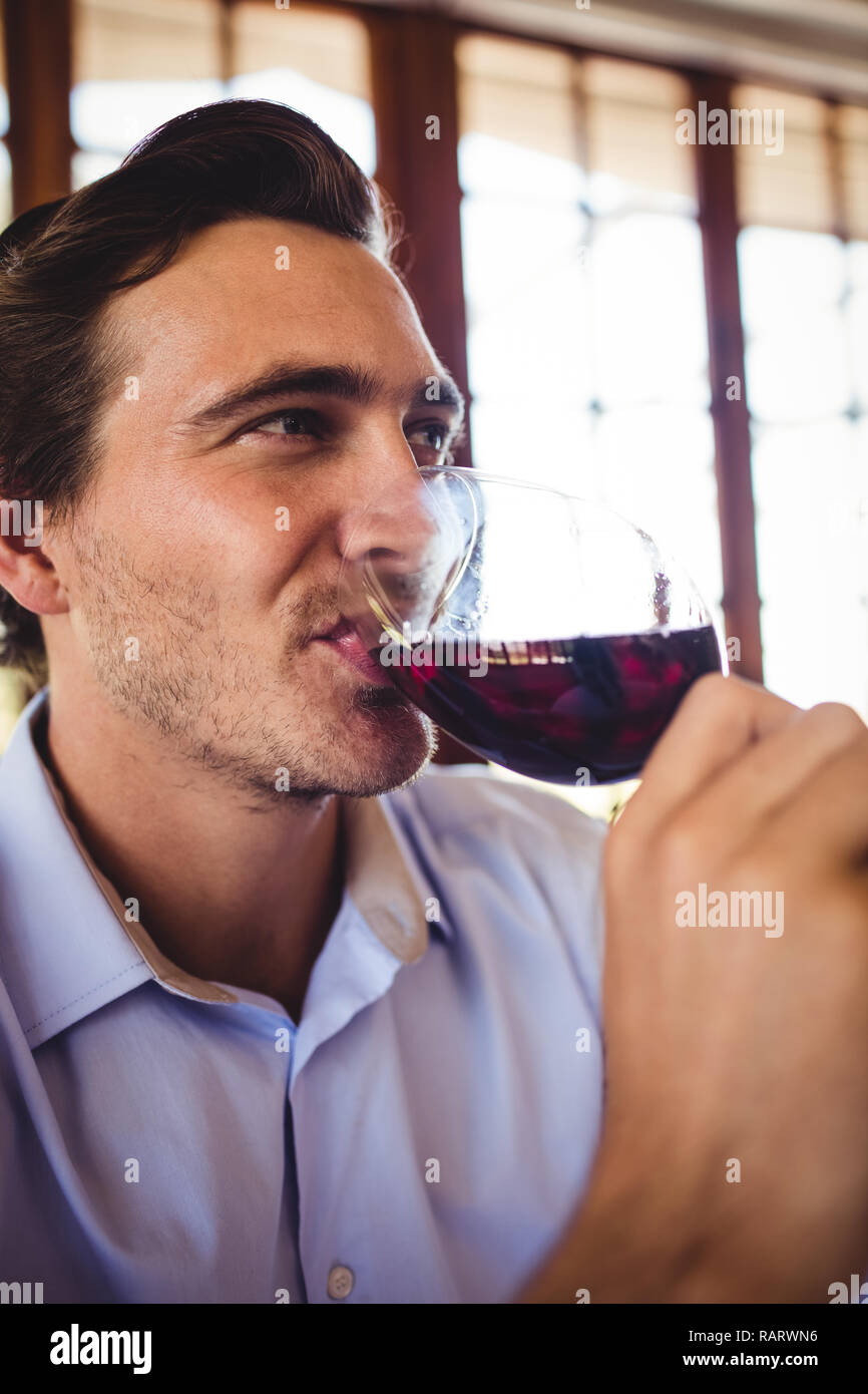 Man having red wine in restaurant Stock Photo