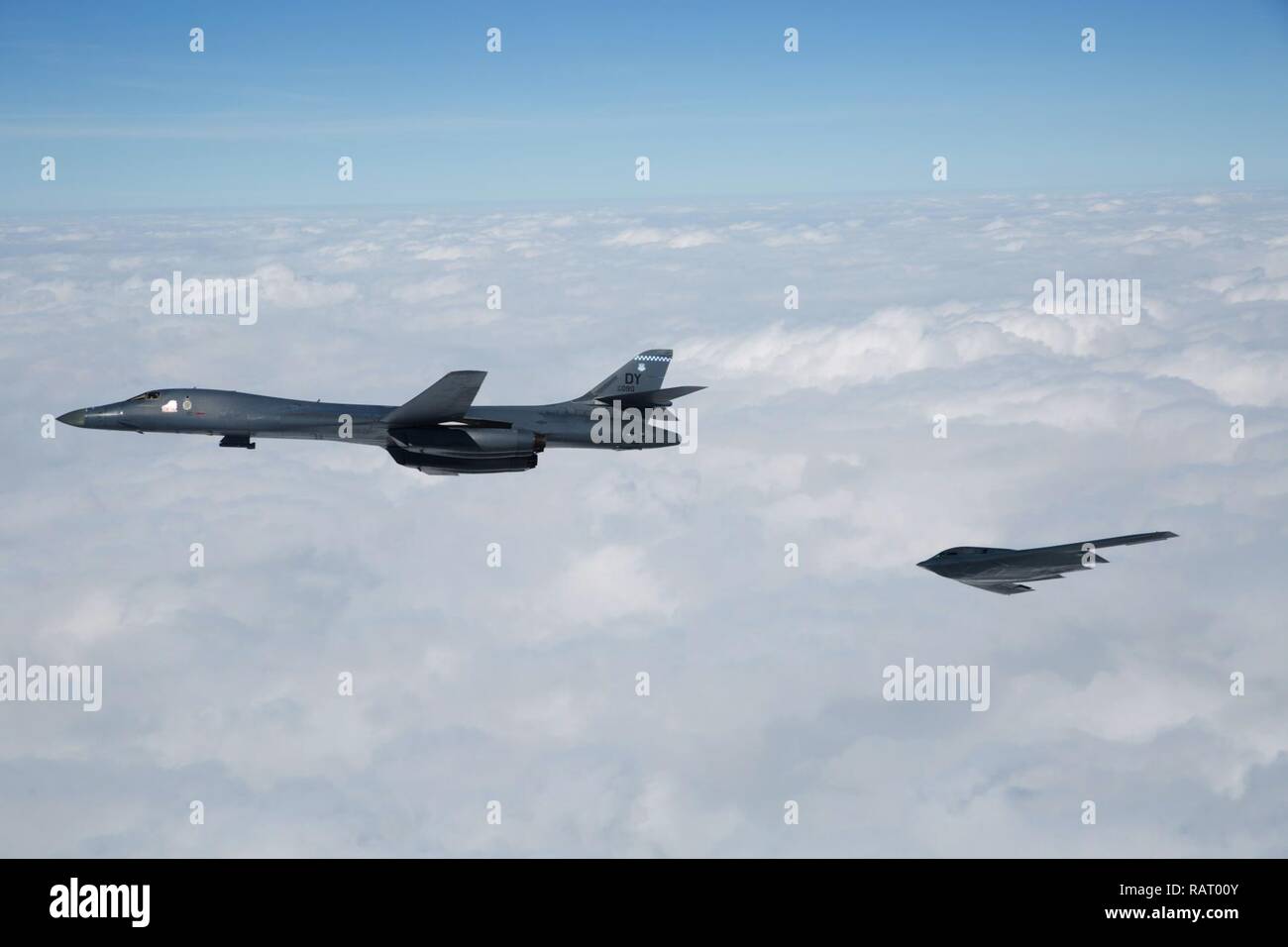A B-1B Lancer and B-2 Spirit fly near Barksdale Air Force Base, La., Feb. 2, 2017. The two bombers, along with a B-52 Stratofortress, flew an in-trail formation over Barksdale AFB during a retreat ceremony held by the Eighth Air Force. Distinguished guests, leadership and ‘Mighty Eighth’ Airmen gathered to celebrate the Eighth Air Force’s 75th anniversary by partaking in various events throughout the week. Eighth Air Force dates back to VIII Bomber Command and World War II, which came into being Feb. 1, 1942. Stock Photo