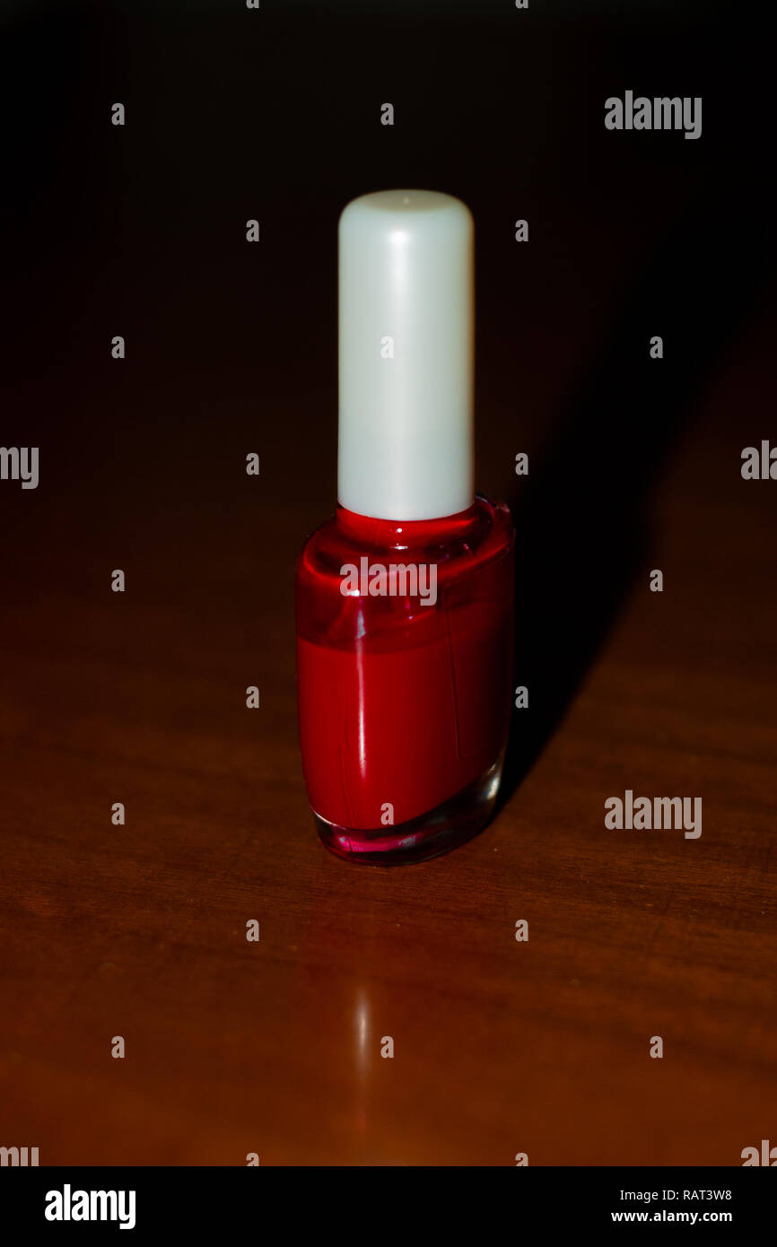 Still life of a woman's red lipstick, ready to be worn Stock Photo