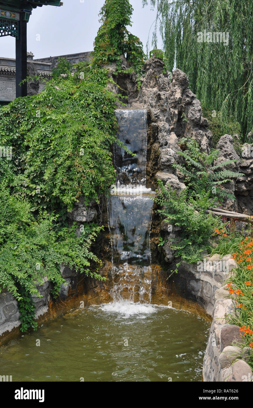 Small waterfall in a courtyard in Pingyao, Shanxi, China Stock Photo