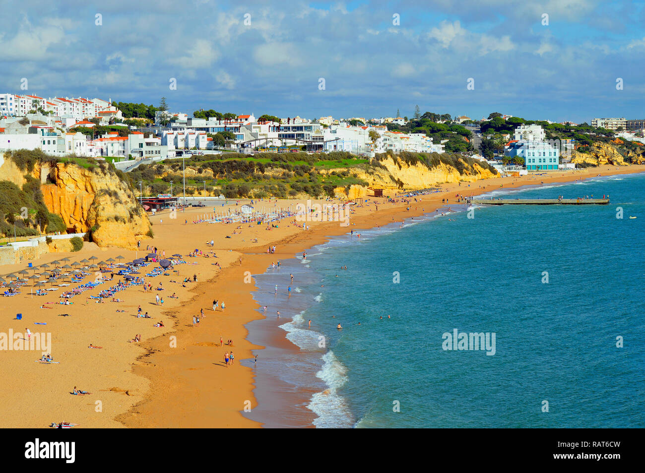 Tourists enjoying the sun on Albufeira Beach in Portugal Stock Photo ...