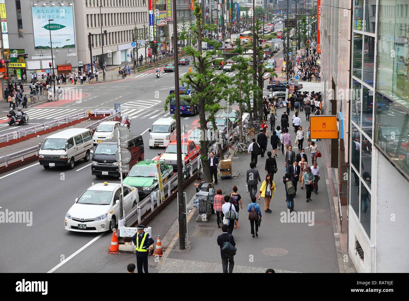 TOKYO, JAPAN - MAY 8, 2012: People drive in Shinjuku, Tokyo, Japan. The ...