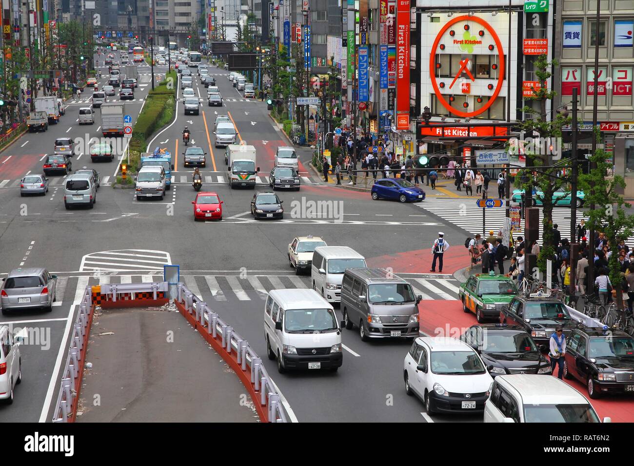 TOKYO, JAPAN - MAY 8, 2012: People drive in Shinjuku, Tokyo, Japan. The ...