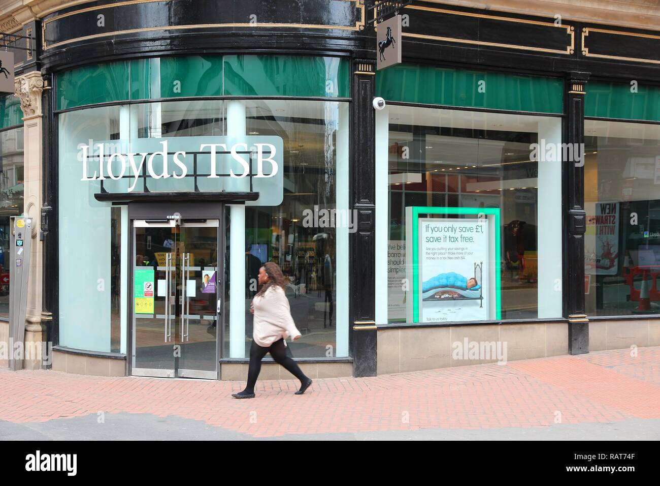 BIRMINGHAM, UK - APRIL 19, 2013: Person walks by Lloyds TSB bank in Birmingham, UK. Lloyds Banking Group had GBP 23.5 billion of revenue in 2011 Stock Photo