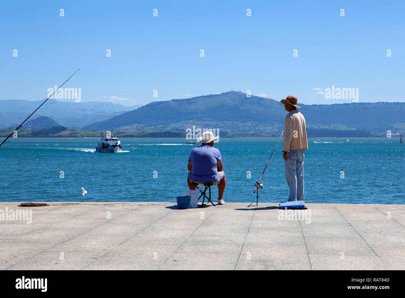 Fishermen on Santander seafront Stock Photo