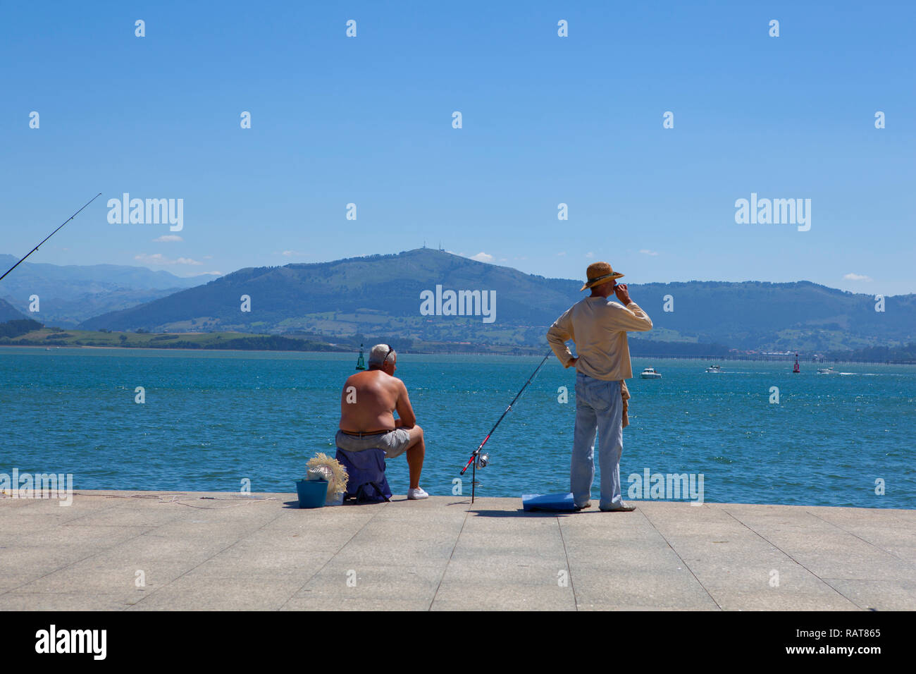 Fishermen on Santander seafront Stock Photo