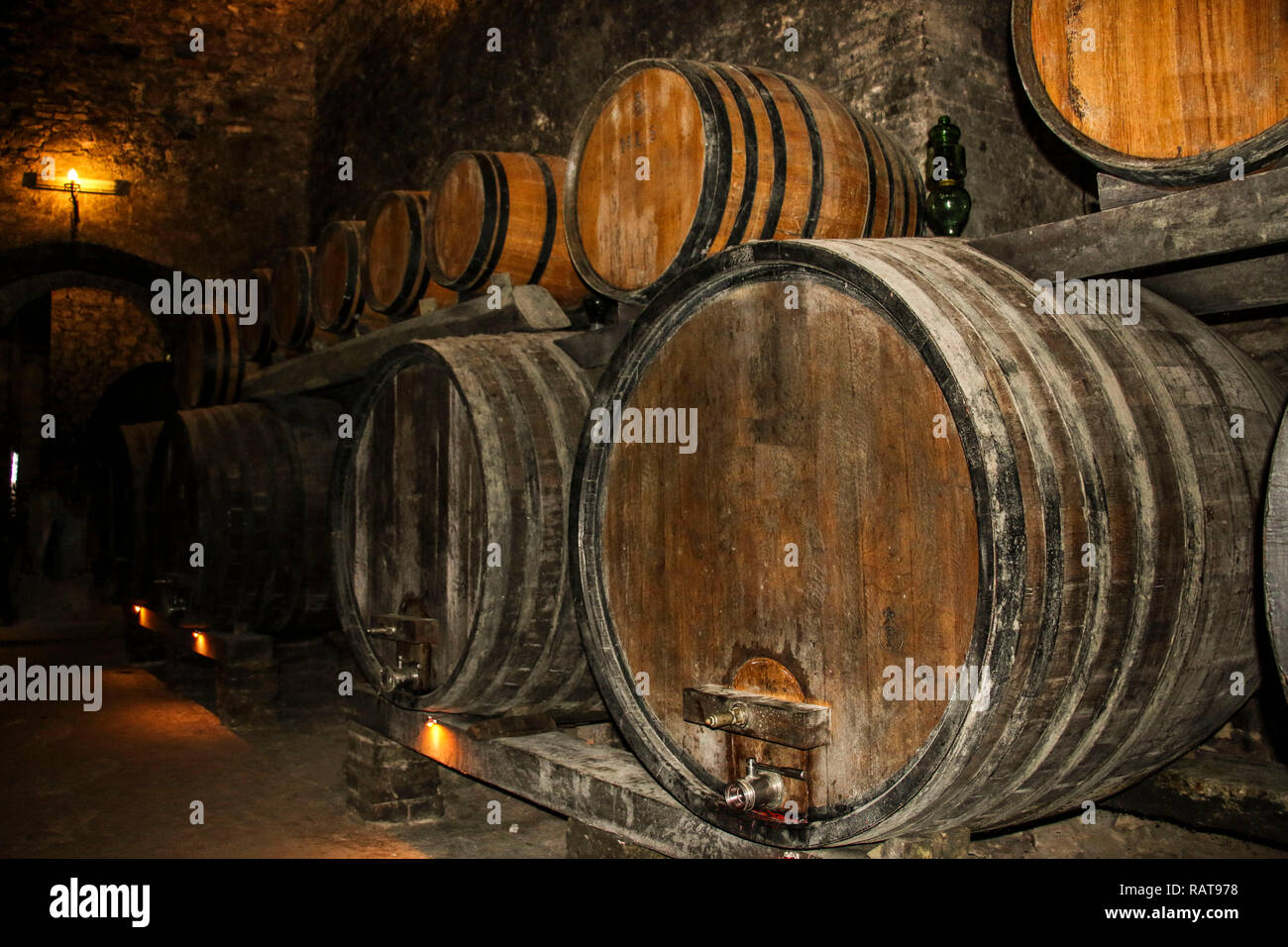 Barrels for storing wine in an old cellar Stock Photo Alamy