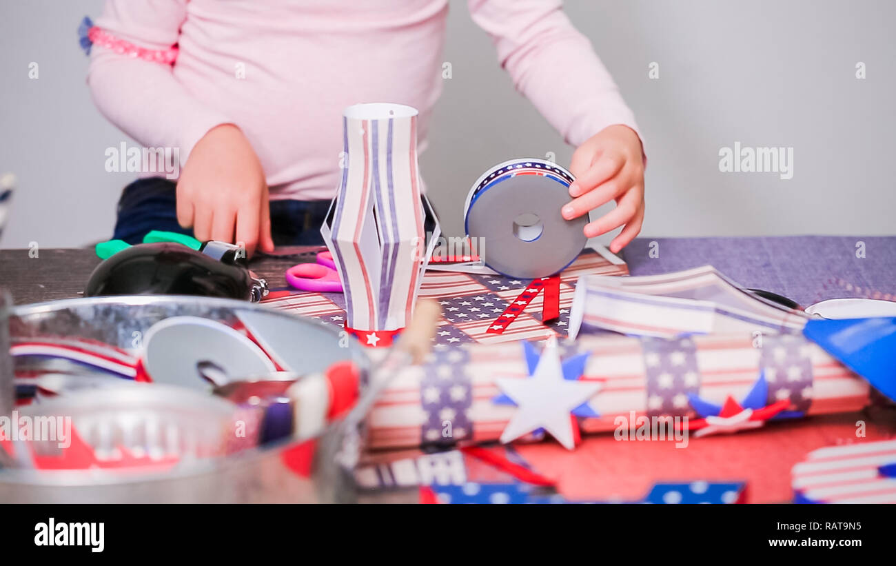 Step by step. Mother and daughter making paper firecrackers for July ...